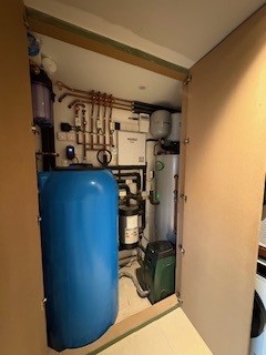 Indoor air source heat pump plant room installation with pipework