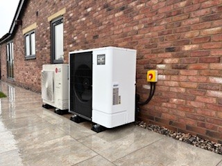 Outdoor air source heat pump unit installed by Ecoheat