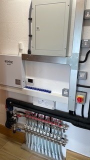 Indoor air source heat pump plant room installation with pipework