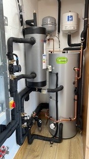 Indoor air source heat pump plant room installation with pipework